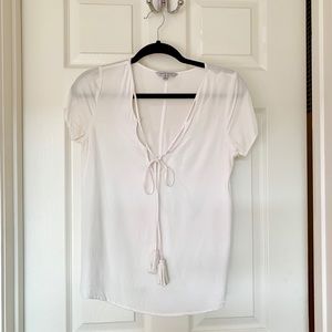 White blouse with tassels